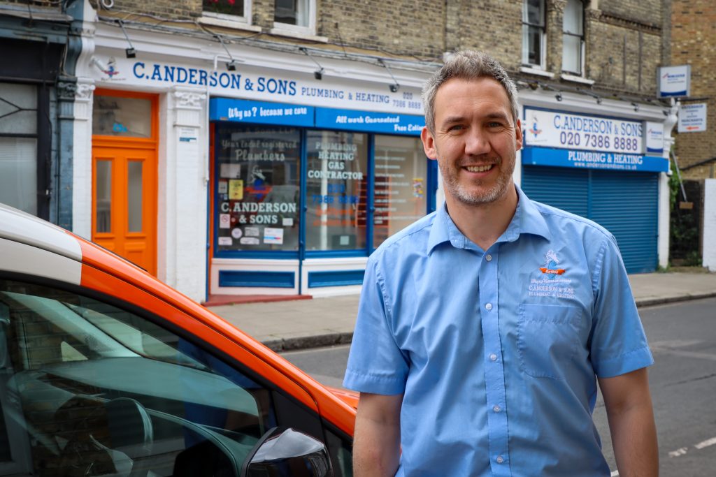 Crawford Anderson of C. Anderson and Sons standing outside their offices